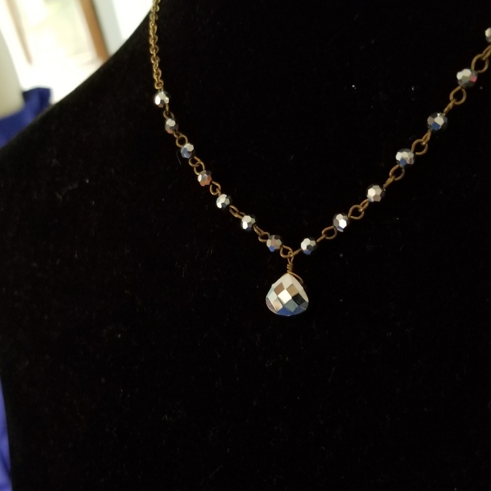 Gold chain with steel colored beads